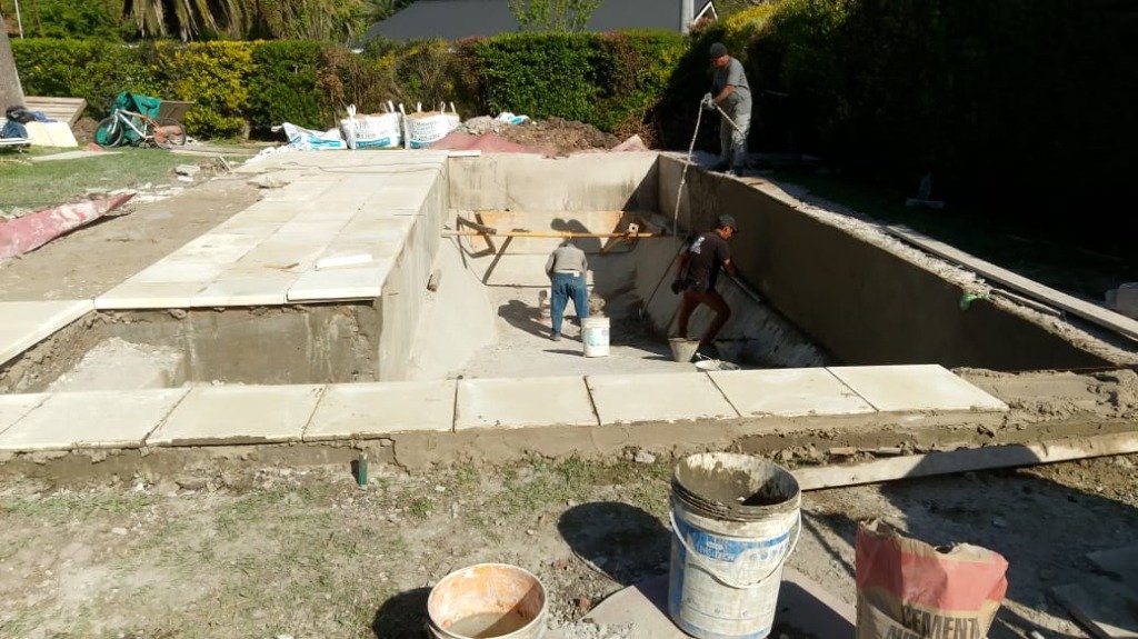 Ejecución — trabajadores en obra